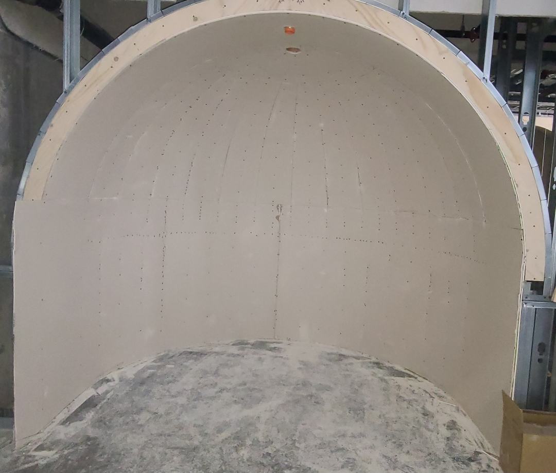 Arched alcove boarded in gypsum before taping