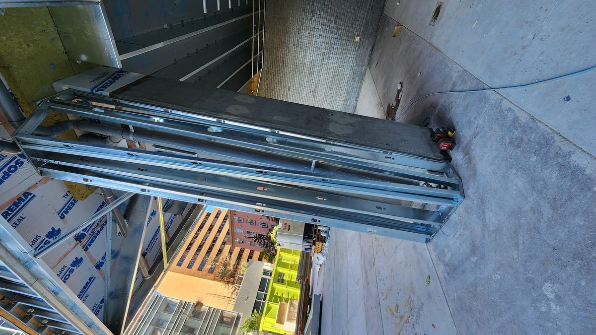 Steel stud column and soffit framing at a building entrance