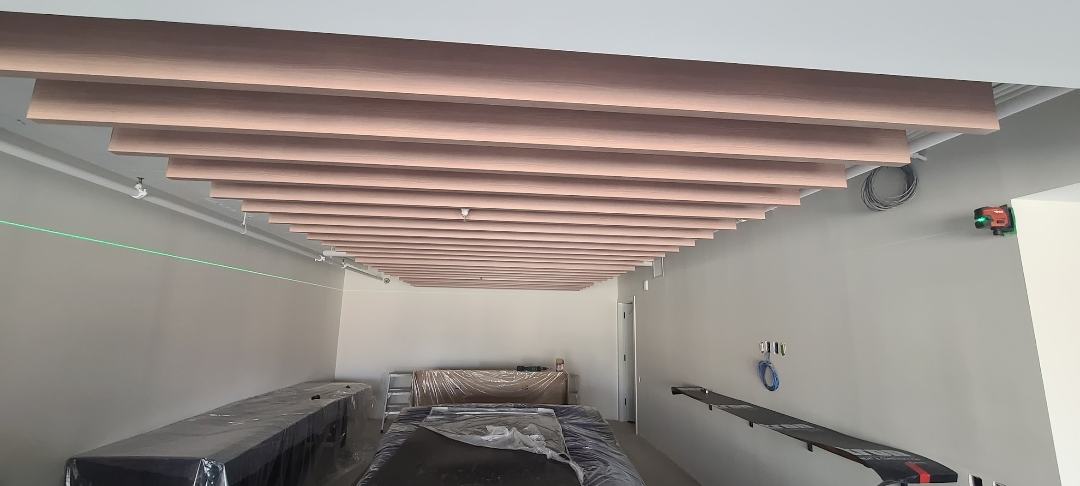 Completed wood slat feature ceiling over a finished room