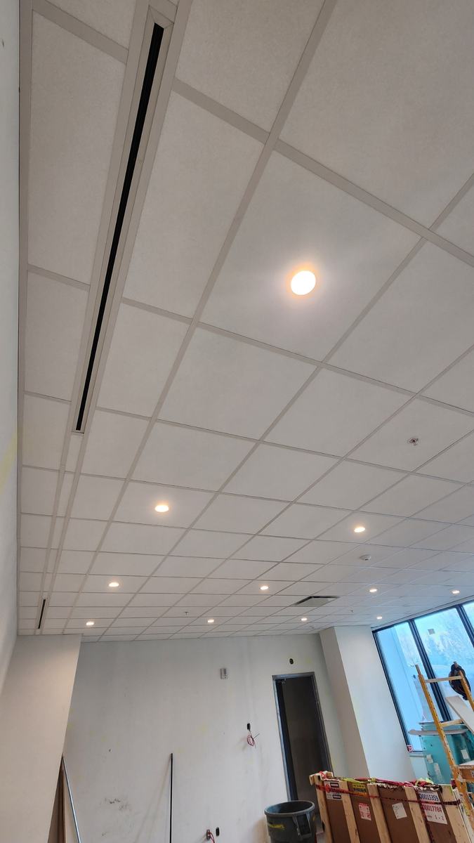 Finished ceiling grid with a linear slot diffuser detail